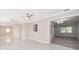 Open concept living space with marble flooring and multiple ceiling fans at 3703 Wade Rd, Orlando, FL 32808