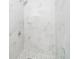 Modern shower with marble-look tiles and a frameless glass enclosure at 3703 Wade Rd, Orlando, FL 32808
