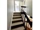 Indoor staircase with wood railing and steps at 4229 S Lake Orlando Pkwy # 133, Orlando, FL 32808
