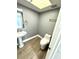 Small bathroom with pedestal sink and skylight at 4229 S Lake Orlando Pkwy # 133, Orlando, FL 32808