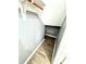 Small closet under the stairs with wood-look flooring at 4229 S Lake Orlando Pkwy # 133, Orlando, FL 32808