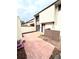 Brick patio with wood fence and townhouse entry at 4229 S Lake Orlando Pkwy # 133, Orlando, FL 32808