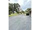 Asphalt road with mature trees on both sides at 4229 S Lake Orlando Pkwy # 133, Orlando, FL 32808
