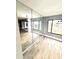 Bright dining room with mirrored wall and wood-look floors at 4229 S Lake Orlando Pkwy # 133, Orlando, FL 32808