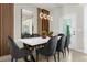 Modern dining room featuring a white table and gray chairs at 4306 Lana Ave, Davenport, FL 33897