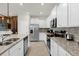 Modern kitchen featuring stainless steel appliances and granite countertops at 4306 Lana Ave, Davenport, FL 33897