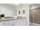 Bathroom with granite countertops, white cabinets, and a walk-in shower at 4306 Lana Ave, Davenport, FL 33897