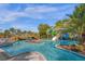 Relaxing lazy river winding through lush tropical landscaping at 4306 Lana Ave, Davenport, FL 33897