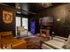 Theater room with comfortable seating, large screen TV, and unique decor at 4306 Lana Ave, Davenport, FL 33897