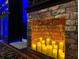 Faux brick fireplace with LED candles at 4306 Lana Ave, Davenport, FL 33897