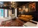 Harry Potter themed game room with leather sofa and armchairs at 4306 Lana Ave, Davenport, FL 33897