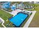 Aerial view of community with a blue basketball court and resort-style pool at 4306 Lana Ave, Davenport, FL 33897