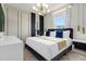 Modern bedroom with a king-size bed and marble accents at 4306 Lana Ave, Davenport, FL 33897