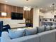 Living area featuring a large TV and comfortable seating at 4306 Lana Ave, Davenport, FL 33897