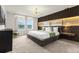 Spacious main bedroom with a large bed, modern lighting, and a stylish accent wall at 4306 Lana Ave, Davenport, FL 33897