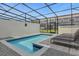 Small screened pool with lounge chairs at 4306 Lana Ave, Davenport, FL 33897