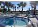 Soothing hot tub surrounded by lounge chairs at 4306 Lana Ave, Davenport, FL 33897
