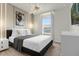 Stylish bedroom featuring a comfortable bed and modern lighting fixtures at 4306 Lana Ave, Davenport, FL 33897