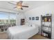 Bright bedroom with a full bed, window with blinds, and bookshelves at 207 Maplebrook Dr, Altamonte Springs, FL 32714