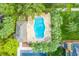 Community pool with lounge chairs and covered patio area at 207 Maplebrook Dr, Altamonte Springs, FL 32714