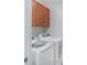 Functional laundry room with washer, dryer, and upper cabinets at 207 Maplebrook Dr, Altamonte Springs, FL 32714