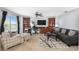 Bright living room with built-in workspace and comfortable seating at 207 Maplebrook Dr, Altamonte Springs, FL 32714