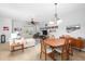 Bright dining area with wood table and chairs, adjacent to living room at 207 Maplebrook Dr, Altamonte Springs, FL 32714