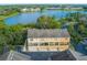 Aerial view of townhouses near a lake, showcasing a desirable community setting at 207 Maplebrook Dr, Altamonte Springs, FL 32714