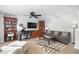 Spacious living room featuring built-in shelving and a cozy sitting area at 207 Maplebrook Dr, Altamonte Springs, FL 32714