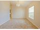 Bright dining room featuring a chandelier and tile floors at 218 Cattail Way, Lake Alfred, FL 33850