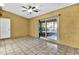 Bright Gathering room with tile floors and sliding glass doors leading to the patio at 2711 Ambrosia Ct, Apopka, FL 32703