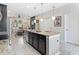 Modern kitchen with granite countertops, stainless steel appliances, and an island at 5128 Caspian St, St Cloud, FL 34771