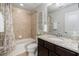 Bathroom with tub, shower, and granite countertop at 5128 Caspian St, St Cloud, FL 34771