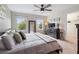 King-size bed, carpeted floor, and large windows in the bedroom at 5128 Caspian St, St Cloud, FL 34771