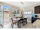 Bright dining room with a table and chairs, and access to a patio at 5128 Caspian St, St Cloud, FL 34771