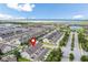 Aerial view of the property and surrounding neighborhood near a lake at 5128 Caspian St, St Cloud, FL 34771