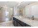 Double vanity bathroom with granite countertop and large shower at 5128 Caspian St, St Cloud, FL 34771