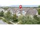 Aerial view highlighting the property's position in a row of townhouses at 5128 Caspian St, St Cloud, FL 34771