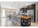 Open kitchen boasting granite countertops, stainless steel appliances, and an island with seating at 5128 Caspian St, St Cloud, FL 34771