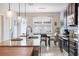 Modern kitchen with granite counters, dark cabinets, and large island at 5128 Caspian St, St Cloud, FL 34771