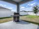 Covered patio with built-in grill, perfect for outdoor entertaining at 911 Avenal, Davenport, FL 33837