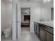 Bathroom with double vanity, toilet and shower/tub combo at 911 Avenal, Davenport, FL 33837