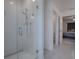 Bathroom with glass shower and grey tile flooring at 911 Avenal, Davenport, FL 33837