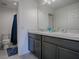 Bathroom with double vanity and shower/tub combo at 911 Avenal, Davenport, FL 33837