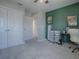 Bedroom with green accent wall and built-in workspace at 911 Avenal, Davenport, FL 33837