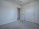 Bedroom with double door closet and carpet flooring at 911 Avenal, Davenport, FL 33837