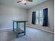 Spacious bedroom with carpeted floor, window with curtains, and ceiling fan at 911 Avenal, Davenport, FL 33837
