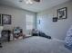 Bedroom with window, ceiling fan, and built-in shelving at 911 Avenal, Davenport, FL 33837