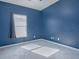 Blue bedroom with carpet flooring and a window at 911 Avenal, Davenport, FL 33837