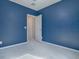 Spacious bedroom with blue walls and carpeted floor at 911 Avenal, Davenport, FL 33837